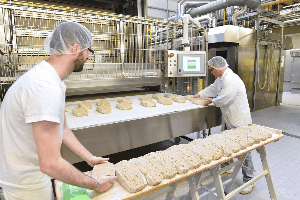 2 guys baking bread